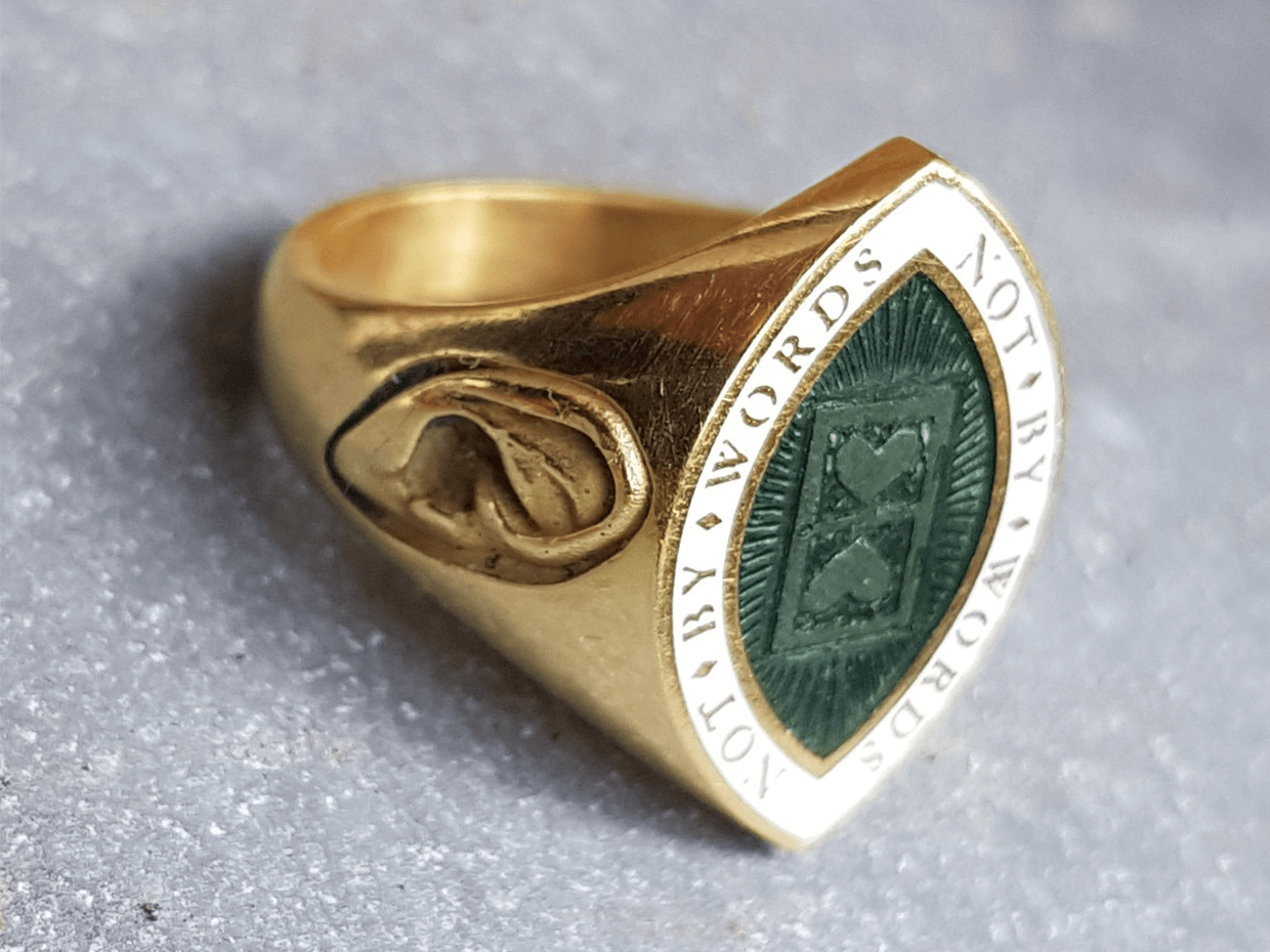 Bespoke Rebus hand engraved memento mori signet ring in 18ct yellow gold and enamel