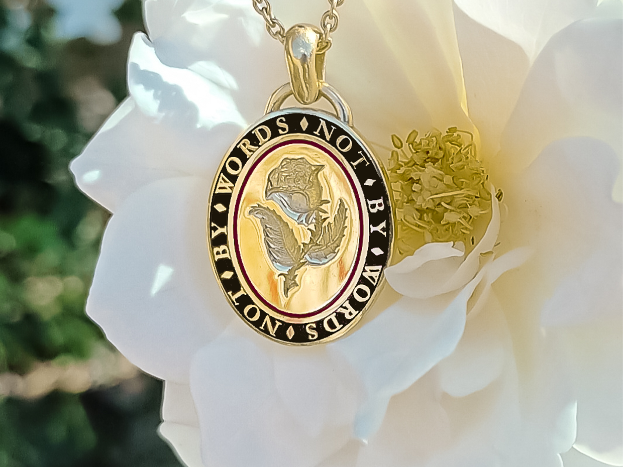 Bespoke Rebus hand engraved memento mori pendant necklace in 18ct yellow gold with black and red enamel