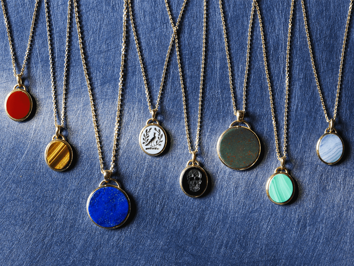 Bespoke Rebus pendants in multiple precious metals, agates, and with personalised engravings