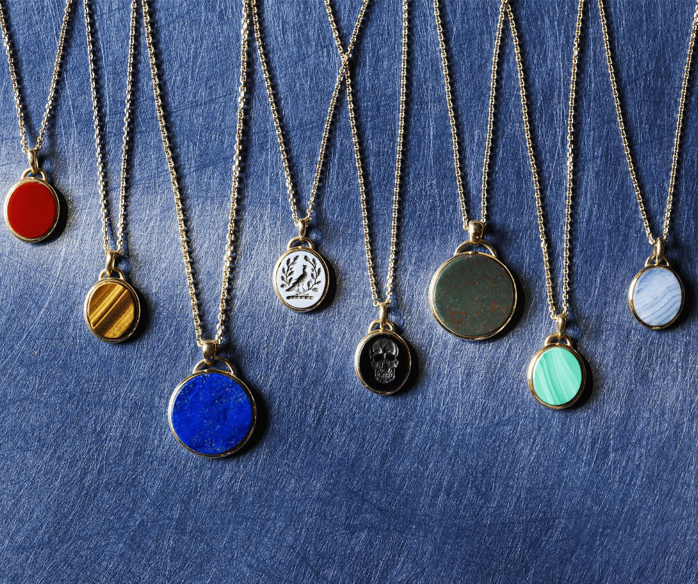 Bespoke Rebus pendants in multiple precious metals, agates, and with personalised engravings